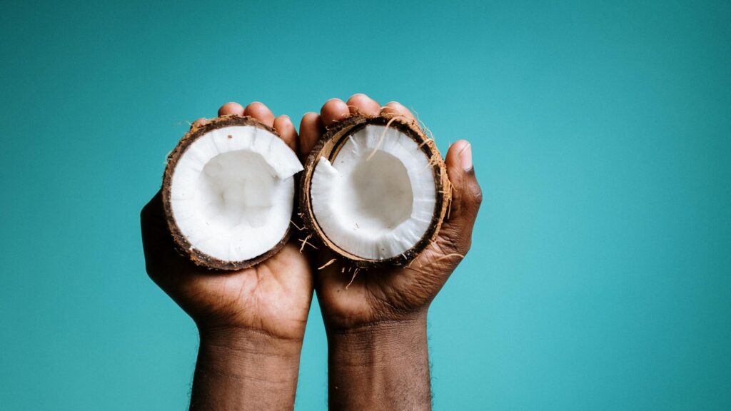 Photo Of Person Holding Coconut